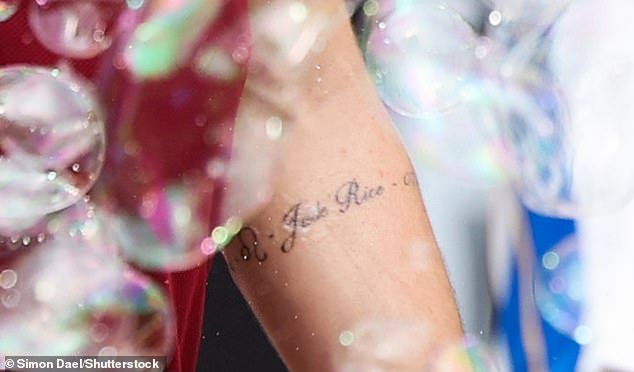 The tattoo, which wrapped around the England international's left forearm, revealed the name Jude, an apparent date of birth and a quote
