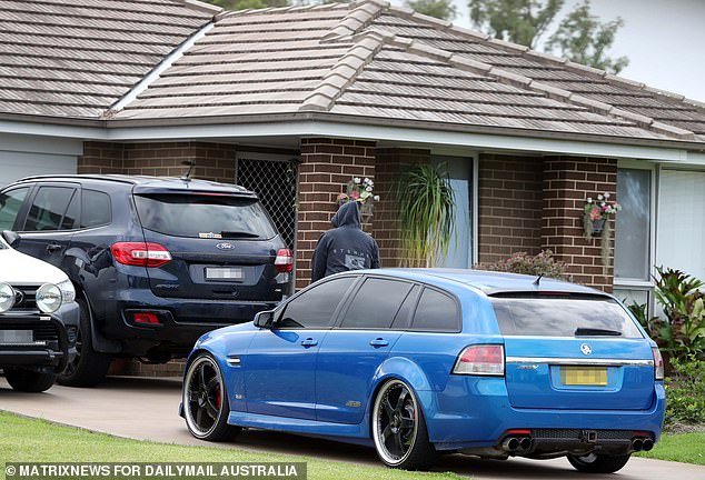 Family of suspect Daniel Billings gather at a Cessnock home where his grim-faced mother and stepfather refused to comment on their son's arrest