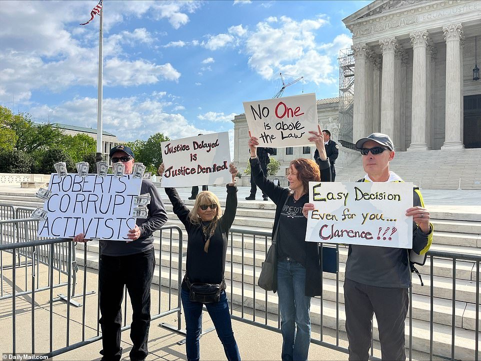 Anti-Trump protesters stood outside the courthouse early Thursday morning.  One man marched with a sign that read, “Lawlessness cannot govern our republic.”  Another sign simply read “loser” in the similar red, white and blue look of the Trump signs.