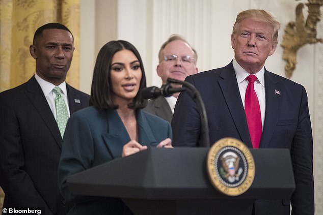 Kim Kardashian (left) speaks to a crowd in the East Room about criminal justice reform with former President Donald Trump (right) in June 2019