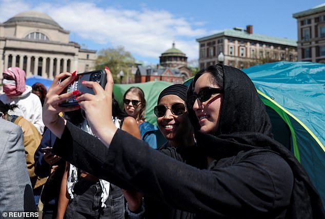 Protesters repeatedly stopped Omar from taking photos with the high-profile progressive