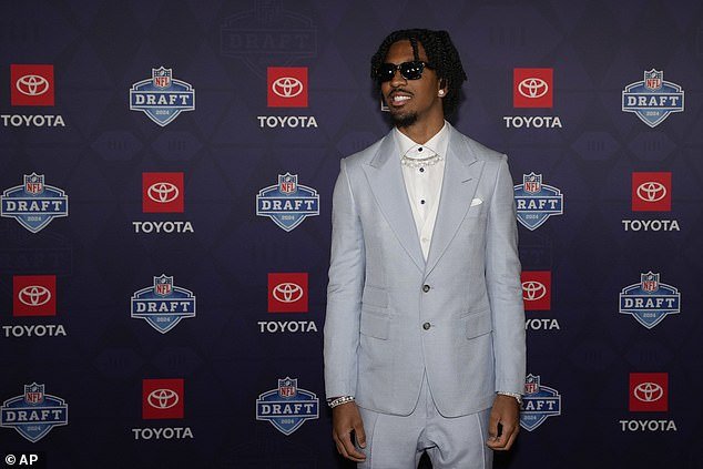 LSU quarterback Jayden Daniels poses on the red carpet prior to the first round of the draft