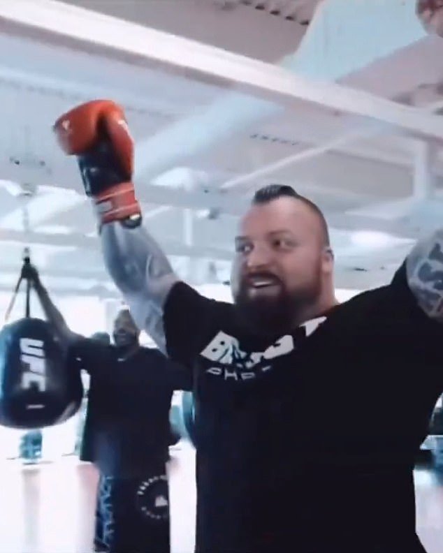 The former World's Strongest Man raised his arms in celebration after achieving the new record
