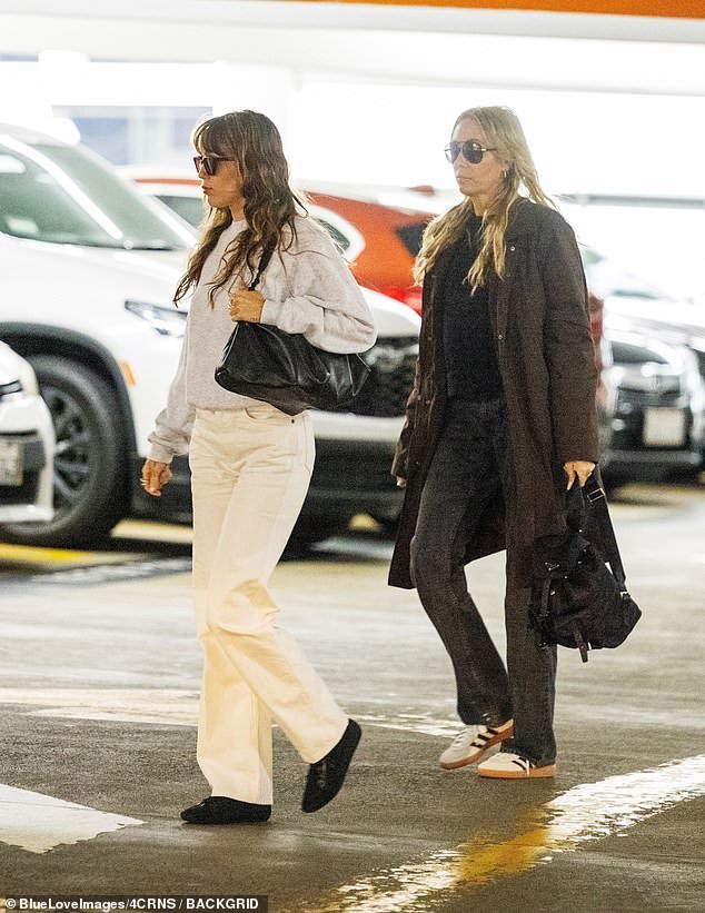 Tish followed her daughter with a backpack in hand