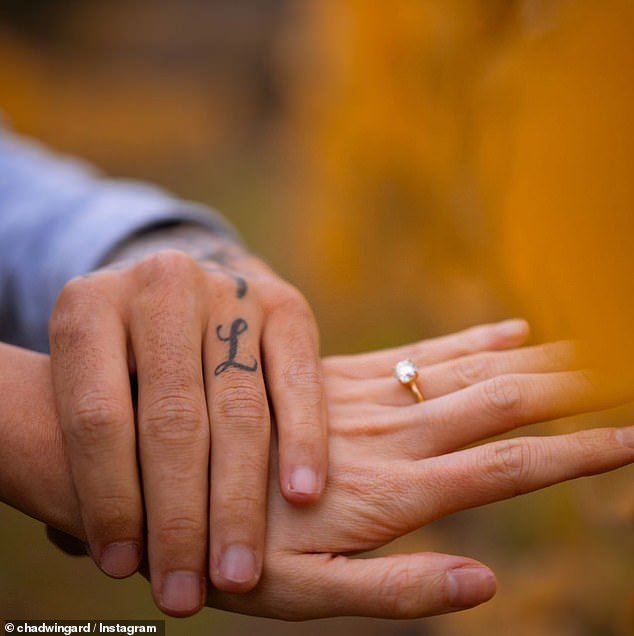 The couple showed off the ring and Wingard's tattoo in honor of Lilly Lloyd to their supporters
