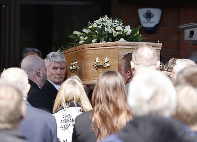 George's casket was carried to his service earlier today