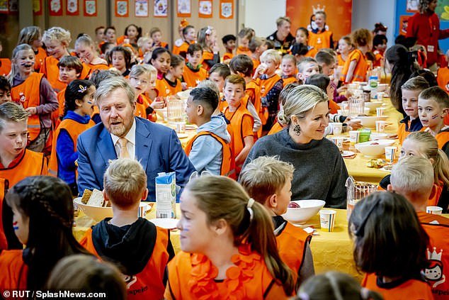 The royal couple were photographed with students at lunch tables as they enjoyed sandwiches, fruit and water in the school canteen