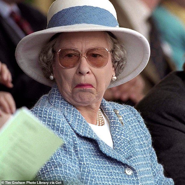 Something in the air?  The Queen seems to think so at the Royal Windsor Horse Show