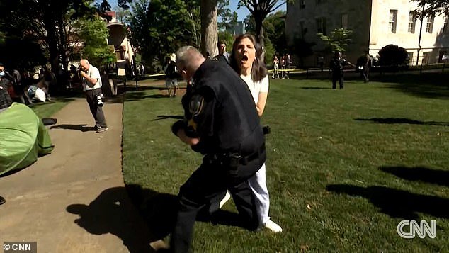 The professor refused a police order to get on the ground before the officer forced her down