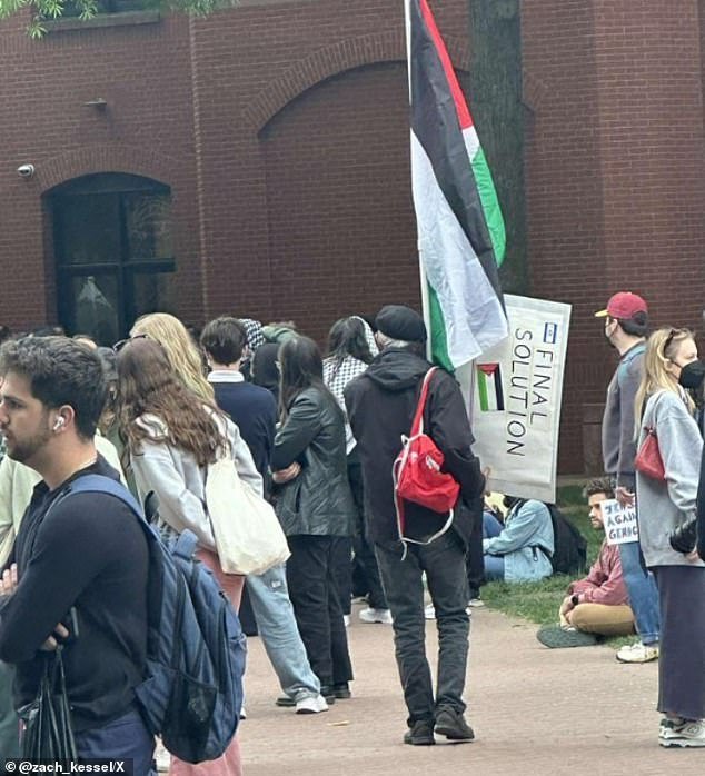 At George Washington University, a protester sparked outrage after he was photographed carrying a sign calling for 'the final solution'