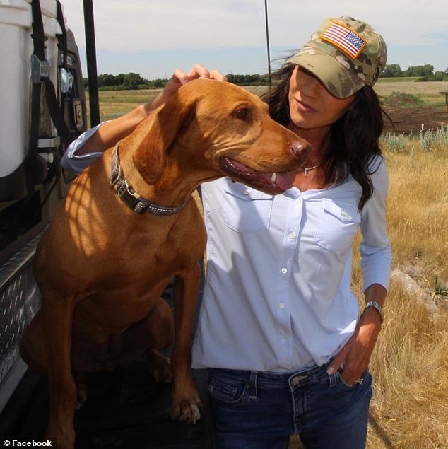 Noem is photographed with another dog she owned, Hazel, a Vizsla