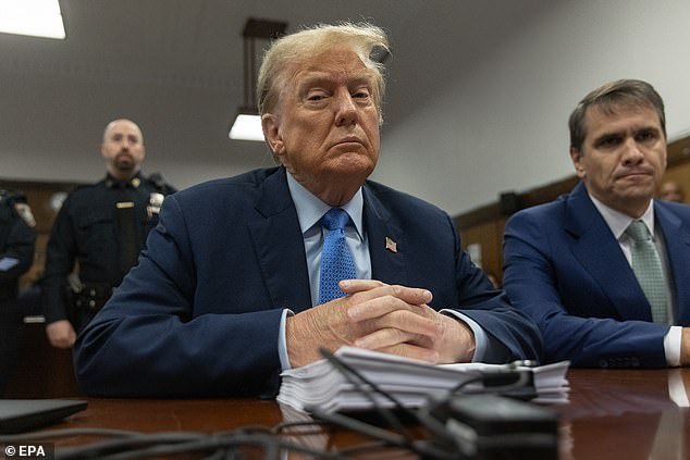Former US President Donald Trump (L) sits in court during his hush money trial at Manhattan Criminal Court in New York, US, April 26, 2024