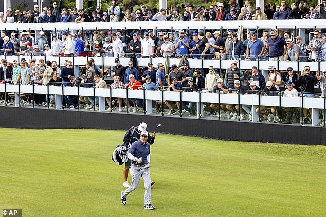 Captain Phil Mickelson of HyFlyers GC walks past the huge crowd on the gallery at the 12th hole in Adelaide