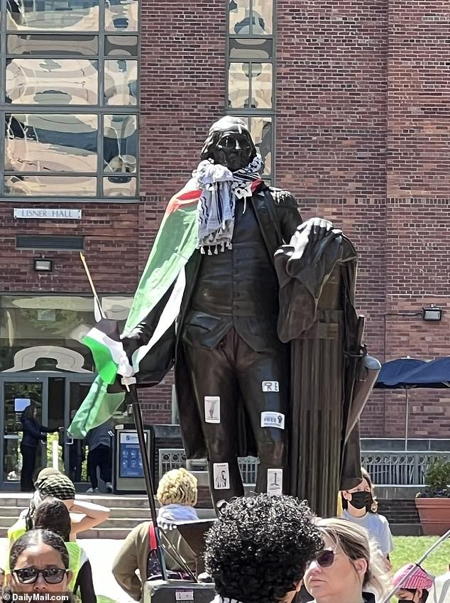 GWU protesters dressed a statue of George Washington in a Palestinian flag and a traditional keffiyeh scarf