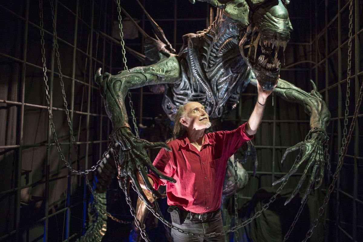 Dan Ohlmann, miniaturist and founder of the “Miniature and Cinema” museum in Lyon, poses with the restored version of the Alien Queen prop from James Cameron's Aliens