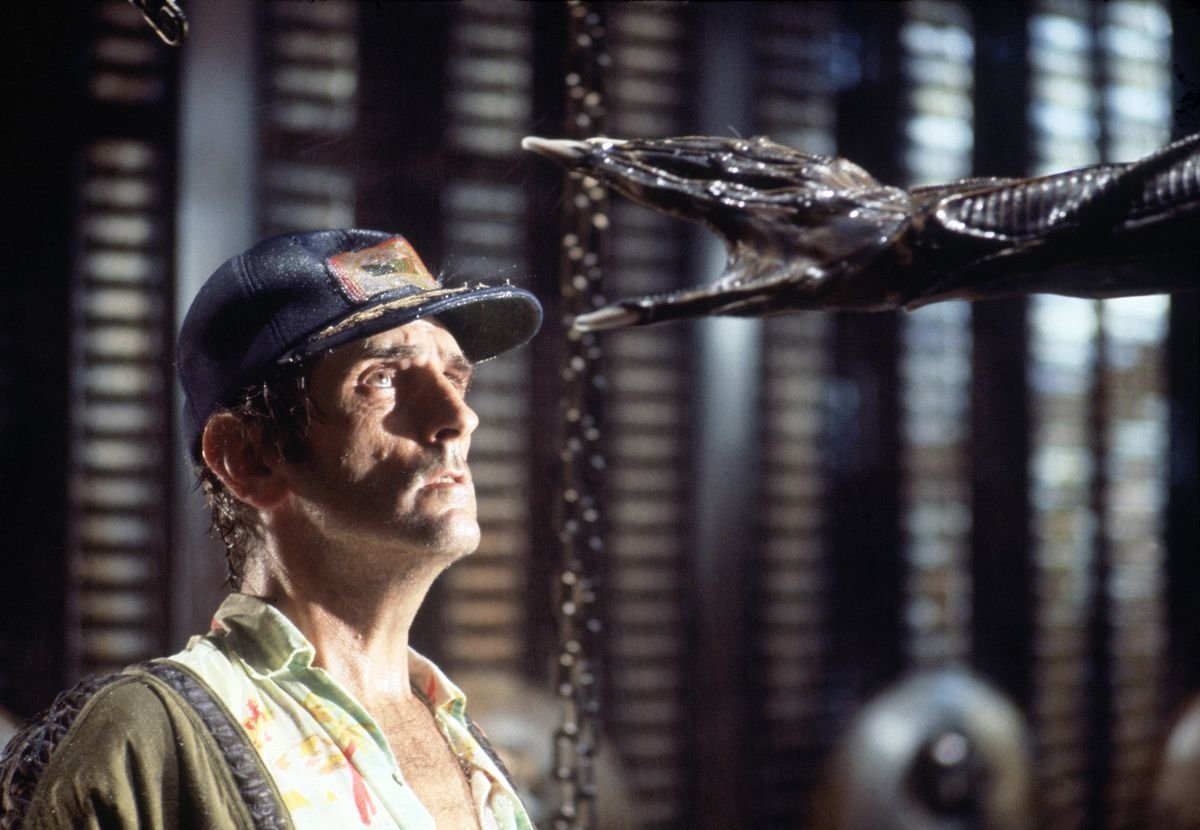 Actor Harry Dean Stanton on the set of 1979's Alien, looks up in fear as the Xenomorph's hand reaches for his head