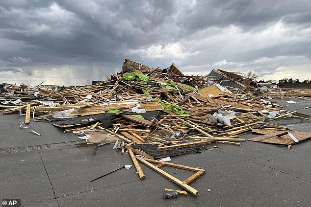 Debris is seen from a destroyed home northwest of Omaha, Nebraska, after a tornado passed through the area