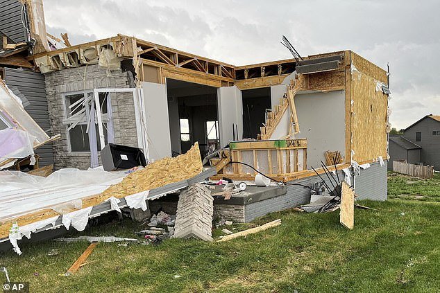Dozens of homes, crushed and torn to shreds as the tornado blazed its path of destruction