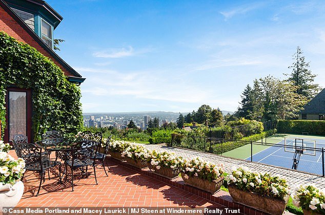 Listing agents highlight the picturesque location in Portland's West Hills, complete with lush gardens, set on 1.17 acres of land, complete with tennis court