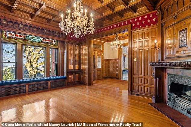 The wooden floor, walls and ceilings can be seen in this photo of the home's private ballroom