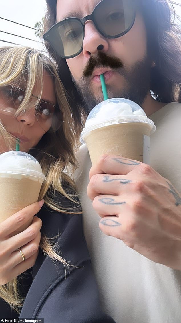 The couple made a quick pit stop to grab some delicious cold coffee drinks during their walk