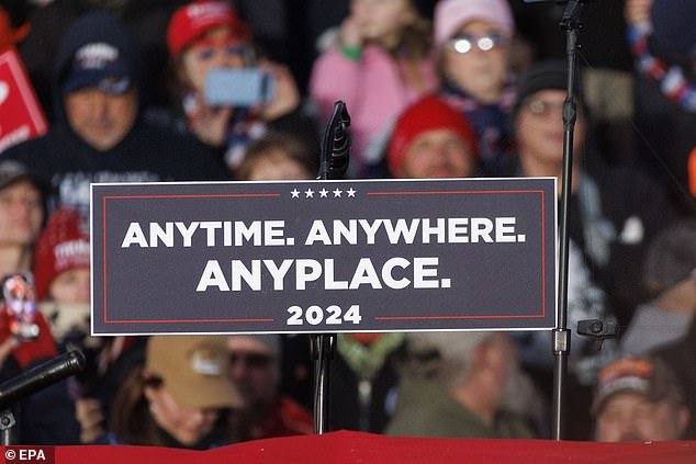 A podium meant to symbolize former President Donald Trump's desire to debate Biden takes the stage at a rally earlier this month in Pennsylvania