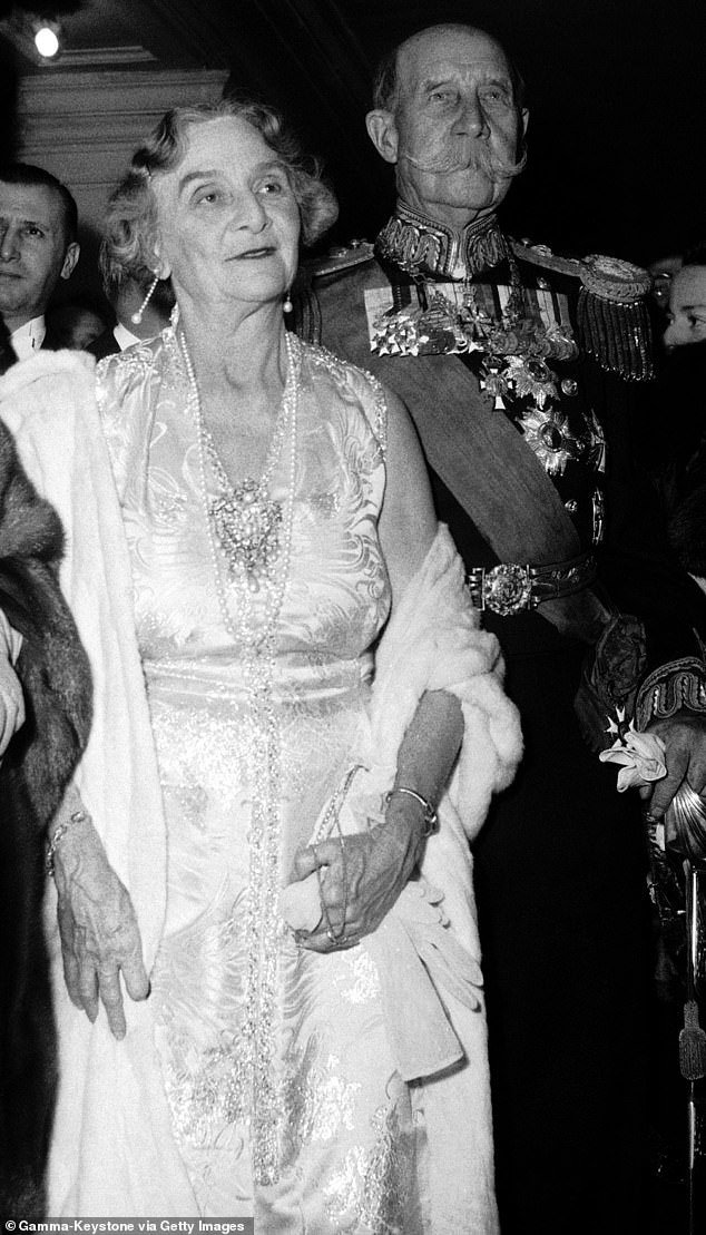 Marie Bonaparte with husband Prince George of Greece and Denmark.  They are photographed at the Paris Opera in 1954