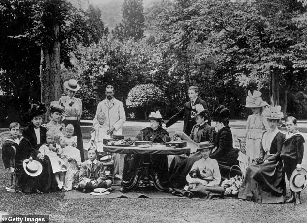 Queen Victoria surrounded by members of the Royal Family at Osborne House on the Isle of Wight, including Princess Ena, third from right