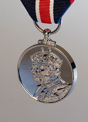 The front of the coronation medal features an image of King Charles and Queen Camilla
