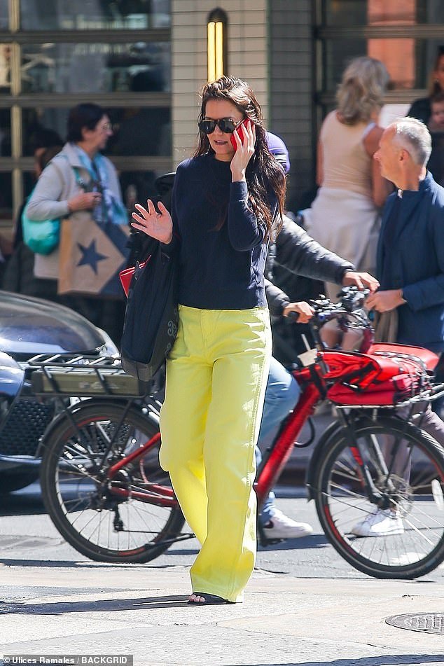 The Dawson's Creek star, 45, wore striking yellow trousers and a navy blue top, teaming it with black sandals