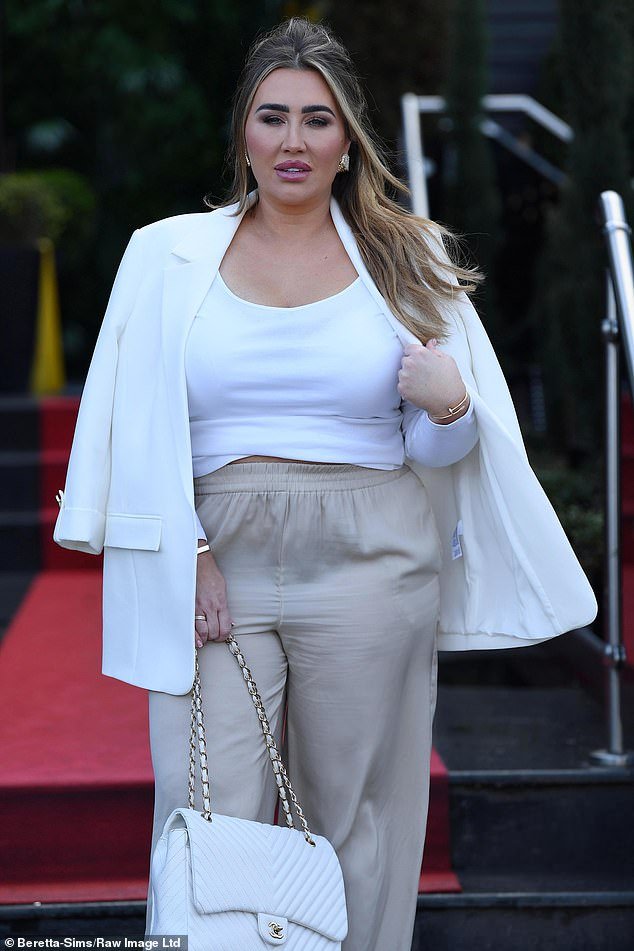 The star, who was an inaugural cast member of the hit reality show, looked stunning in loose khaki pants and a white long-sleeved top