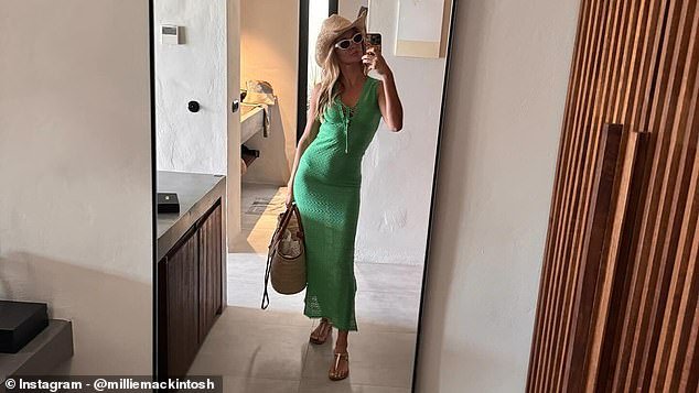 Back inside, she kept the green going, donning a gorgeous maxi dress and pairing it with gold sandals and a beach bag