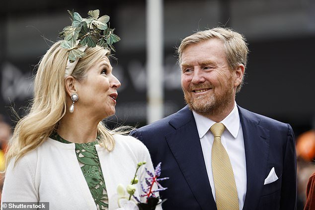 Máxima was a vision in an olive green dress with a subtle floral design