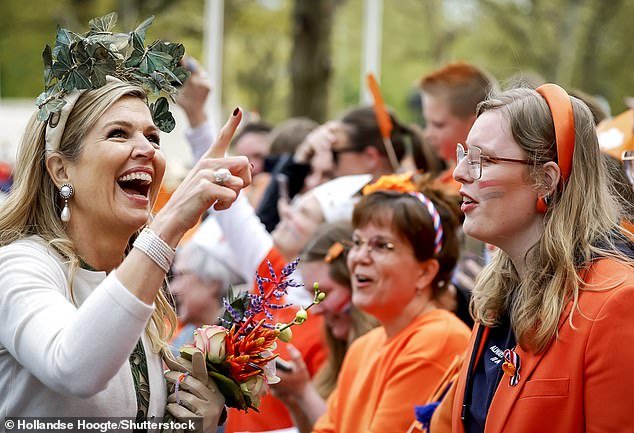 The Dutch queen, 52, and her husband King Willem-Alexander were in good spirits as they met with students from KBS Klippeholm and CBS Vesterhave