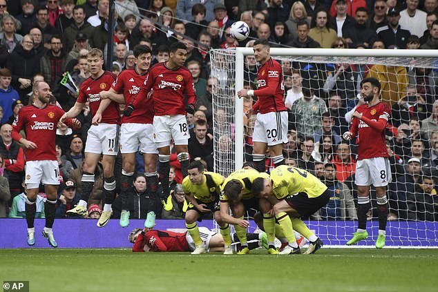 Manchester United players try to block a free kick from Burnley's Jacob Bruun Larsen