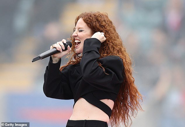 Jess looked sensational as her fiery red curls flowed freely in the French breeze as hundreds of enthusiastic rugby fans turned out