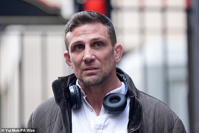 Alex Reid leaves the Rolls Building in central London on Friday after attending a bankruptcy hearing for his former partner Katie Price