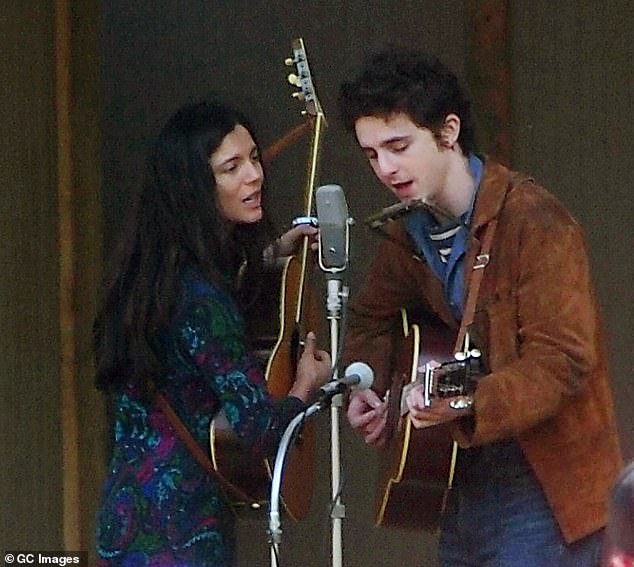 Indie Wire shared a video of Chalamet and Monaca Barbaro, who stars as Joan Baez, singing a duet on April 16.  He plays guitar and harmonica in the festival setting