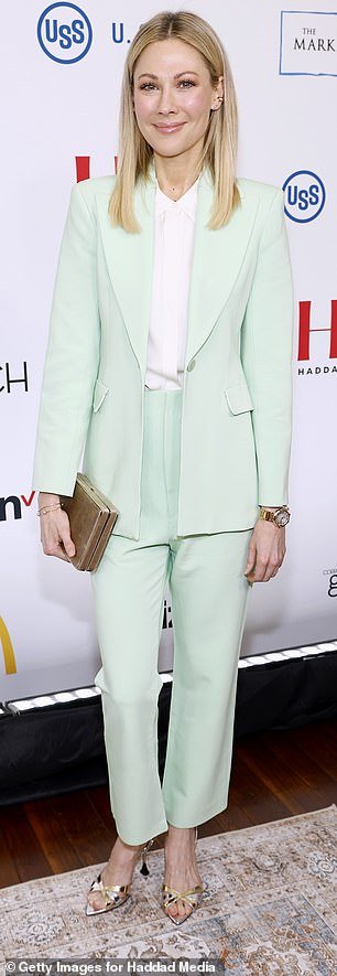 Desi looked beautiful in a mint green suit and white shirt.  The pants were shorter at the ankle and the unbuttoned jacket fell to mid-thigh