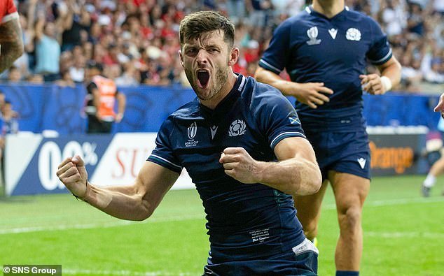The versatile star celebrates a try against Tonga during last year's World Cup