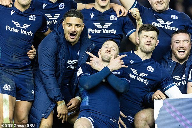 Kinghorn (second from right) enjoys victory in the Calcutta Cup with cheerful Finn Russell