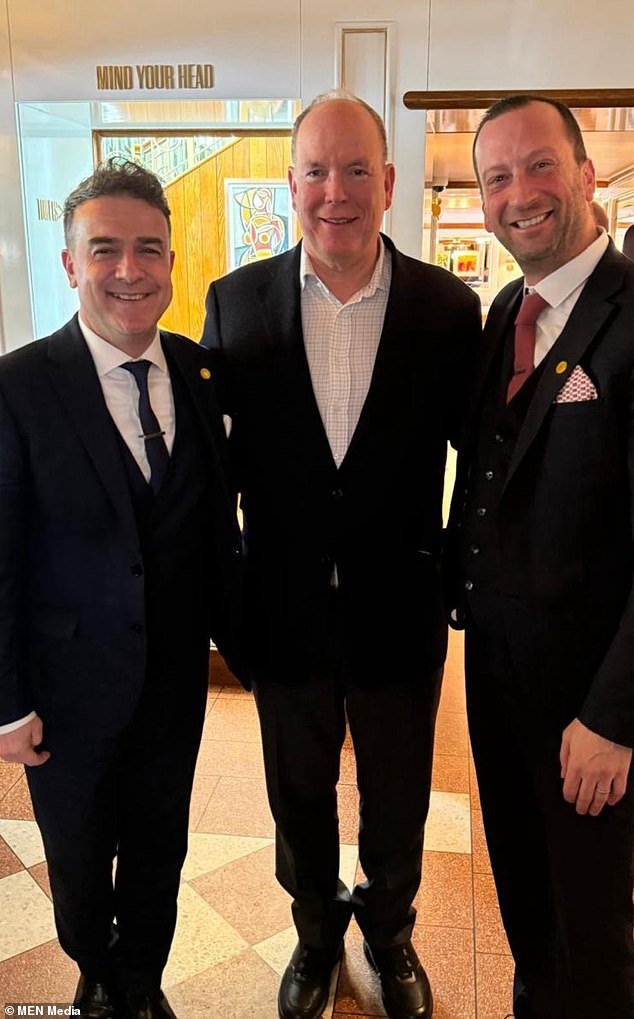 Prince Albert of Monaco (C) is pictured last Friday with two managers of Italian restaurant San Carlo, based in Alderley Edge