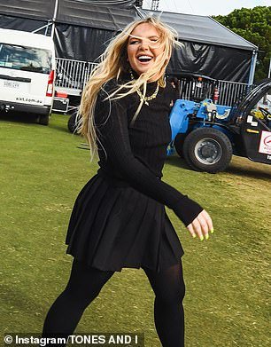 The Dance Monkey star took to Instagram to share photos of herself at the event looking almost unrecognizable in a black turtleneck, matching mini skirt and back tights.