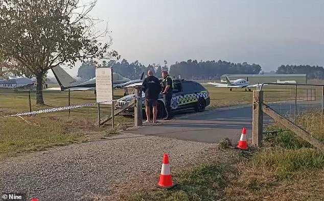 Witnesses reported seeing the plane apparently struggling to land before crashing into a meadow just short of the runway (photo, police on scene)