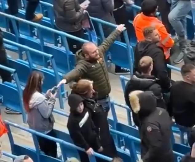 A Manchester City fan was caught on social media in March allegedly making an airplane gesture
