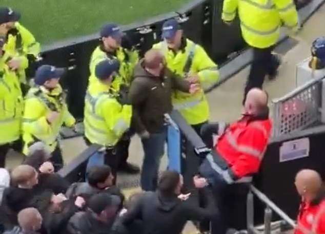 Later footage showed the man being escorted out of the Manchester derby by stewards