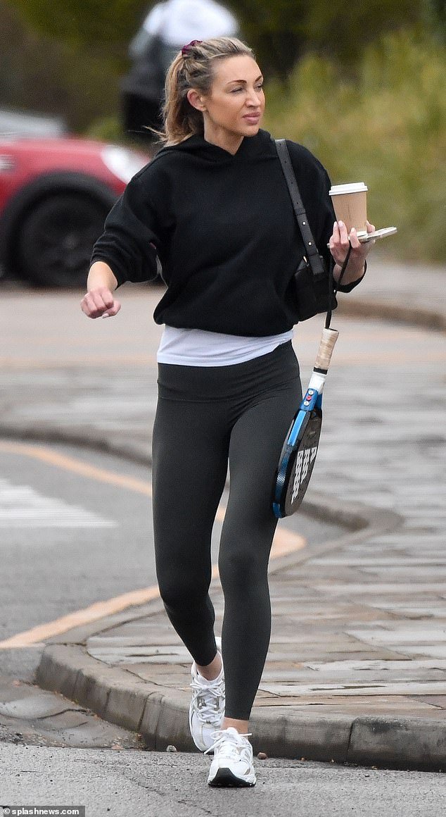 The lingerie model, 36, opted for a casual and comfortable ensemble for her morning outing and wore a black cropped hoodie