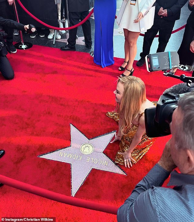 Christian captured the actress gracefully kneeling next to her star on the Walk of Fame on Hollywood Blvd in her figure-hugging sparkling gold dress