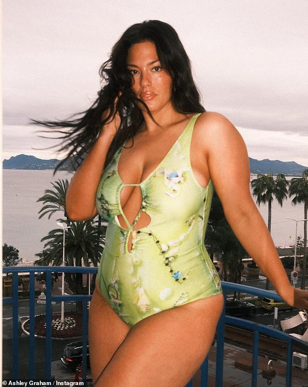 The 36-year-old fashion stunned in a lime green patterned swimsuit as her hair flowed in the wind