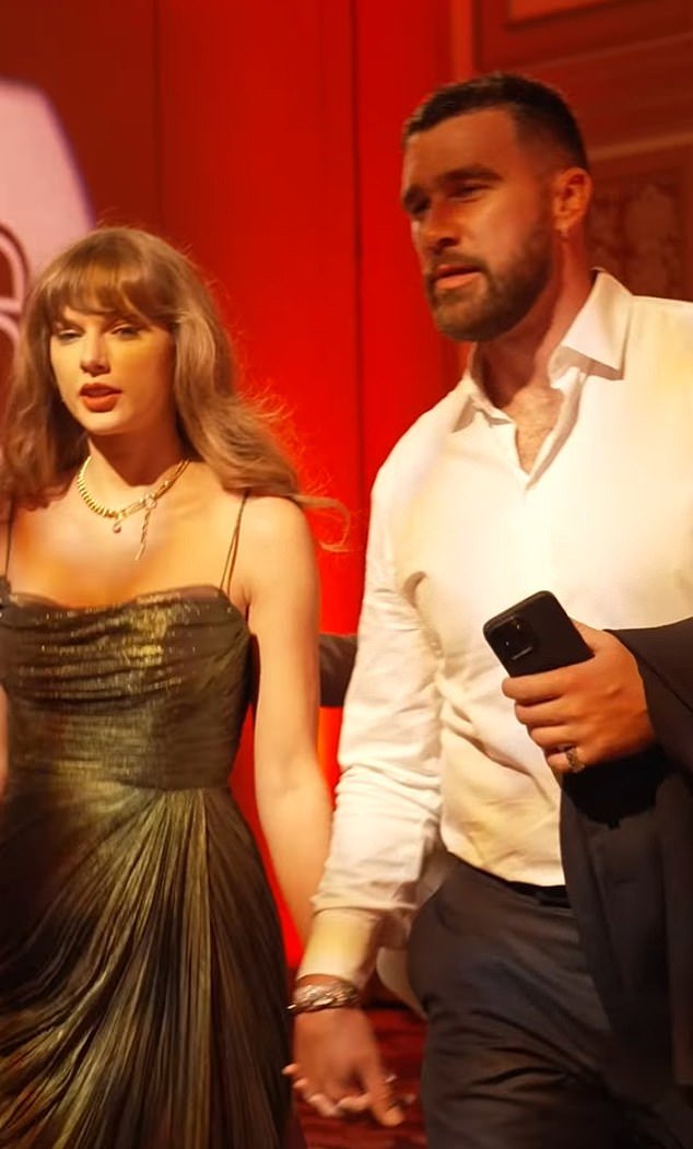 Travis Kelce is seen attending the event hand-in-hand with girlfriend Taylor Swift